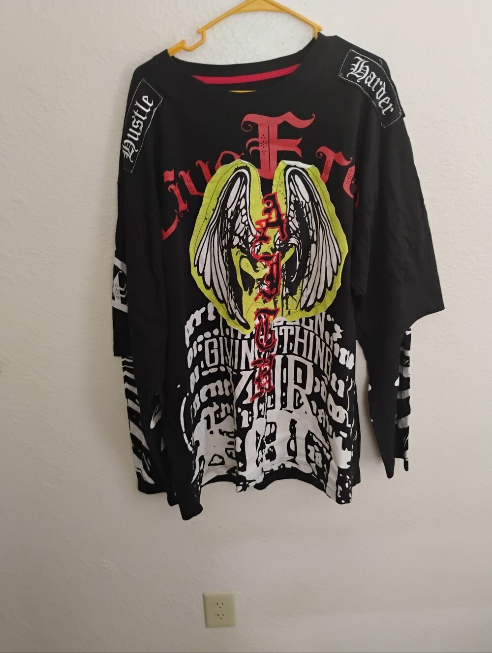 Men's Black Long Sleeve Graphic Tee with Neon Wing Crest